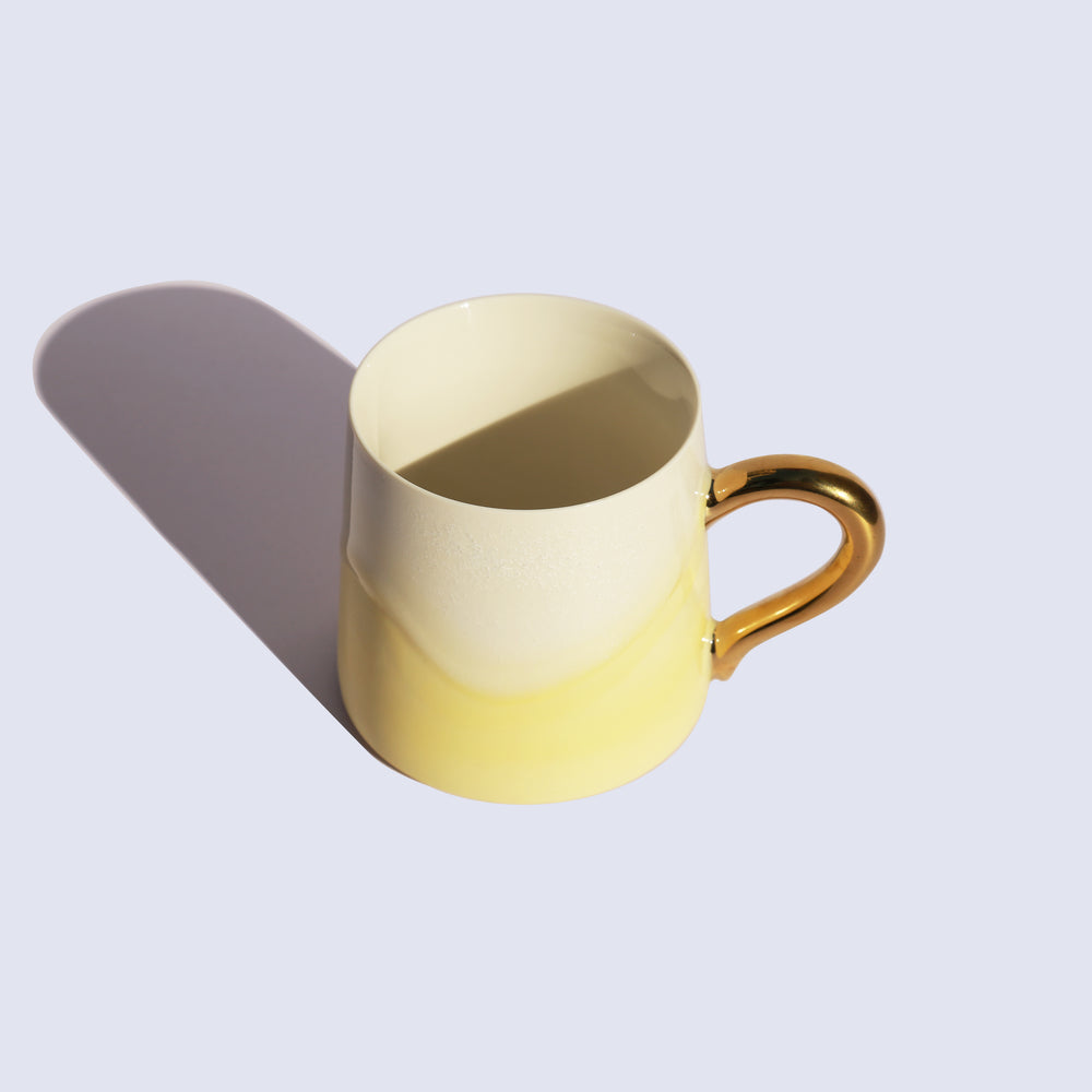 
                  
                    Light Yellow Coffee Mug with Gold Handle
                  
                