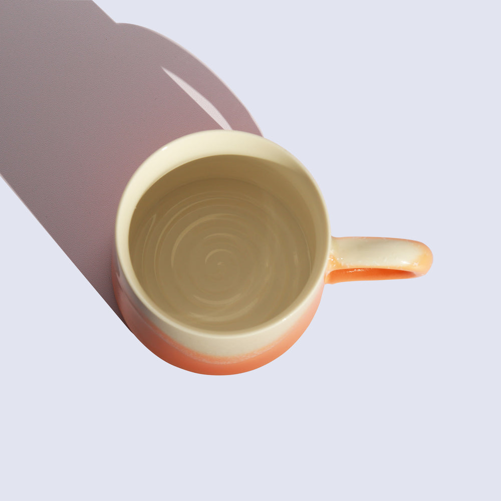 
                  
                    Orange ceramic mug
                  
                