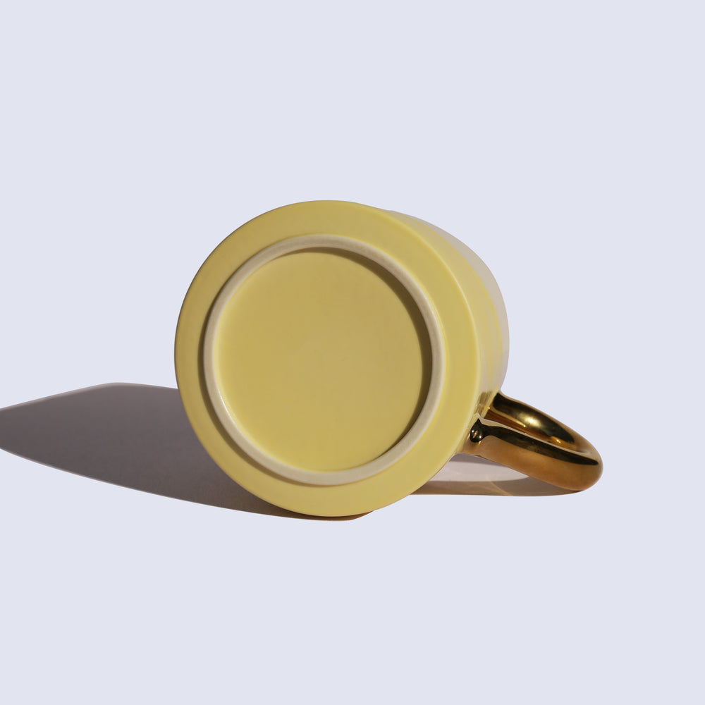 
                  
                    Light Yellow Coffee Mug with Gold Handle
                  
                