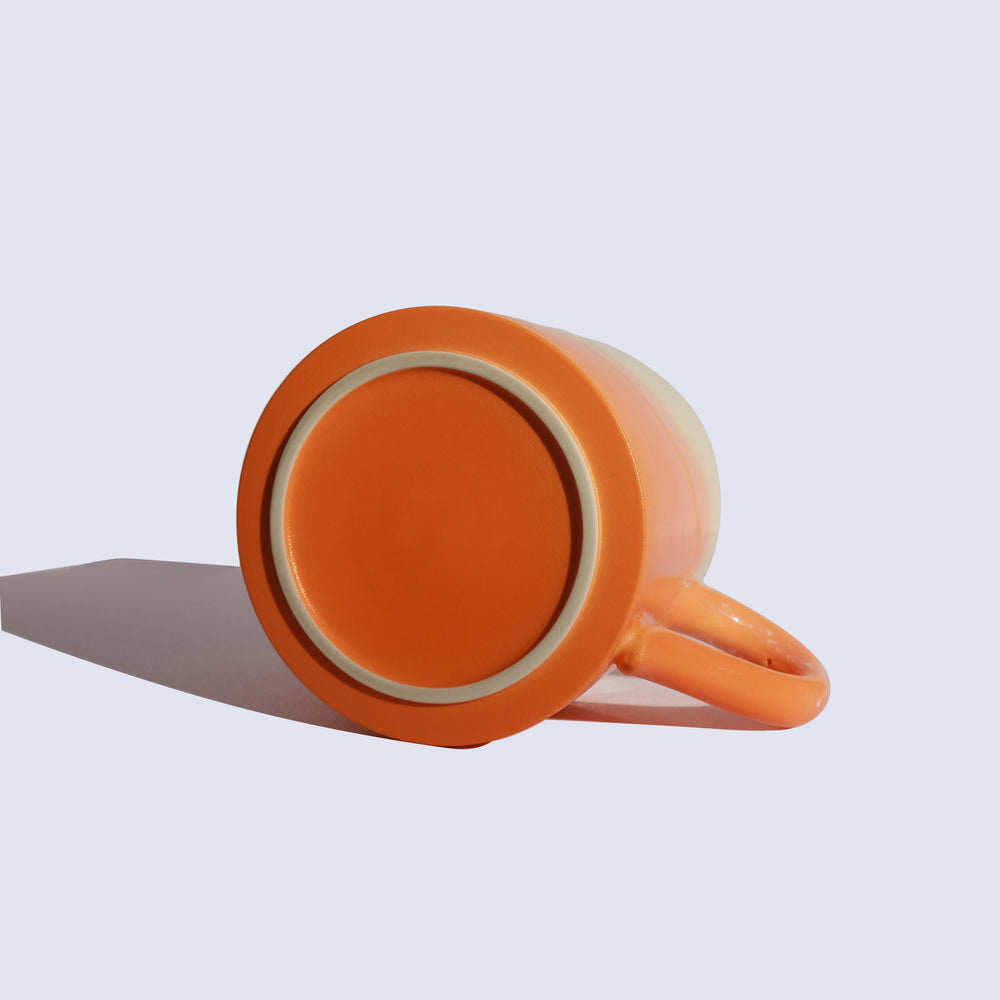 
                  
                    Orange ceramic mug
                  
                