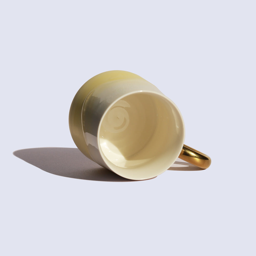 
                  
                    Light Yellow Coffee Mug with Gold Handle
                  
                