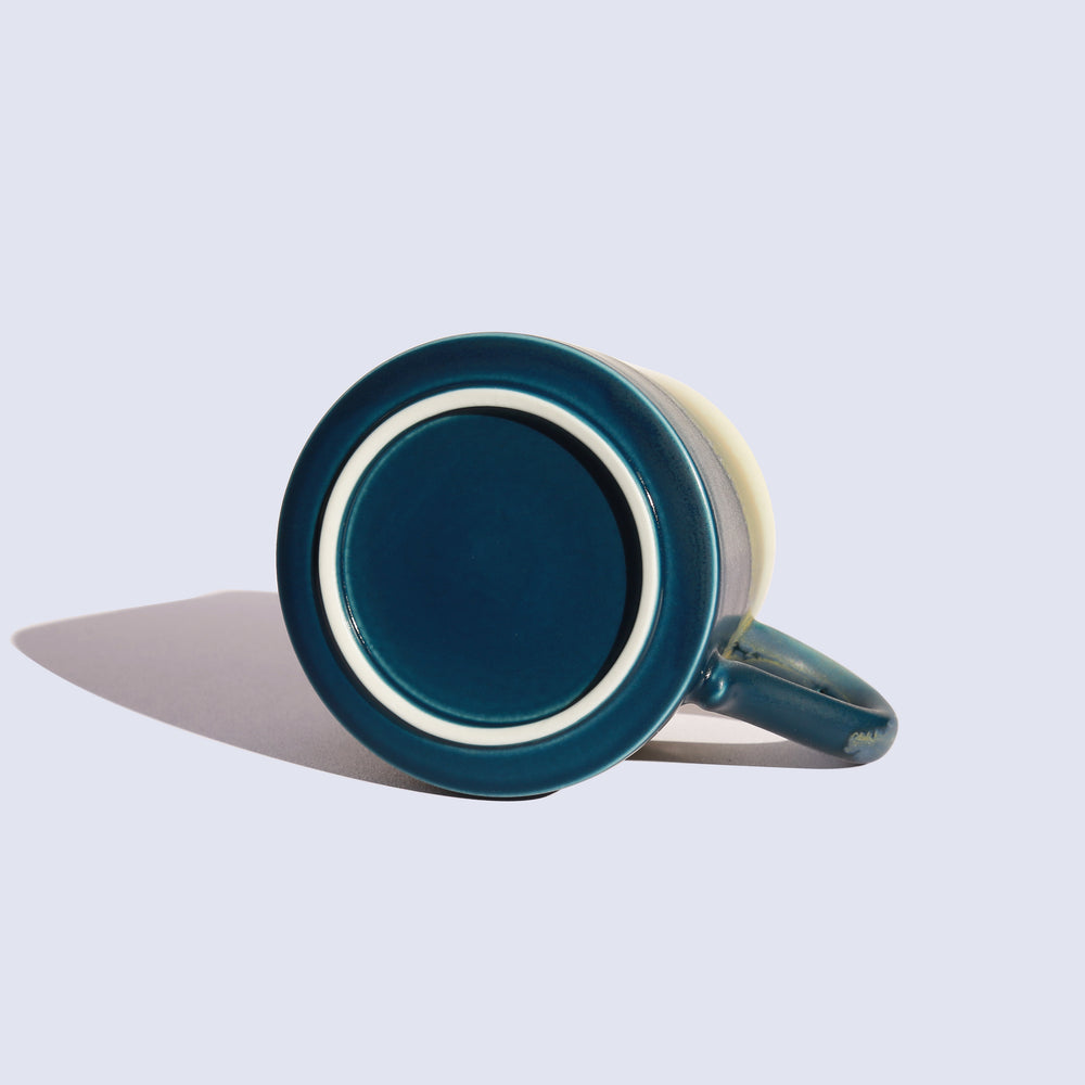 
                  
                    Blue ceramic coffee mug
                  
                