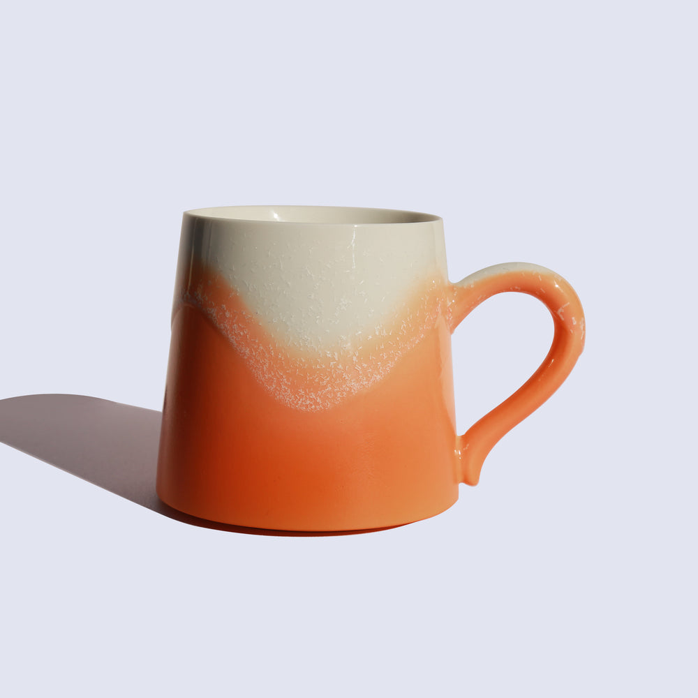 
                  
                    Orange ceramic mug
                  
                