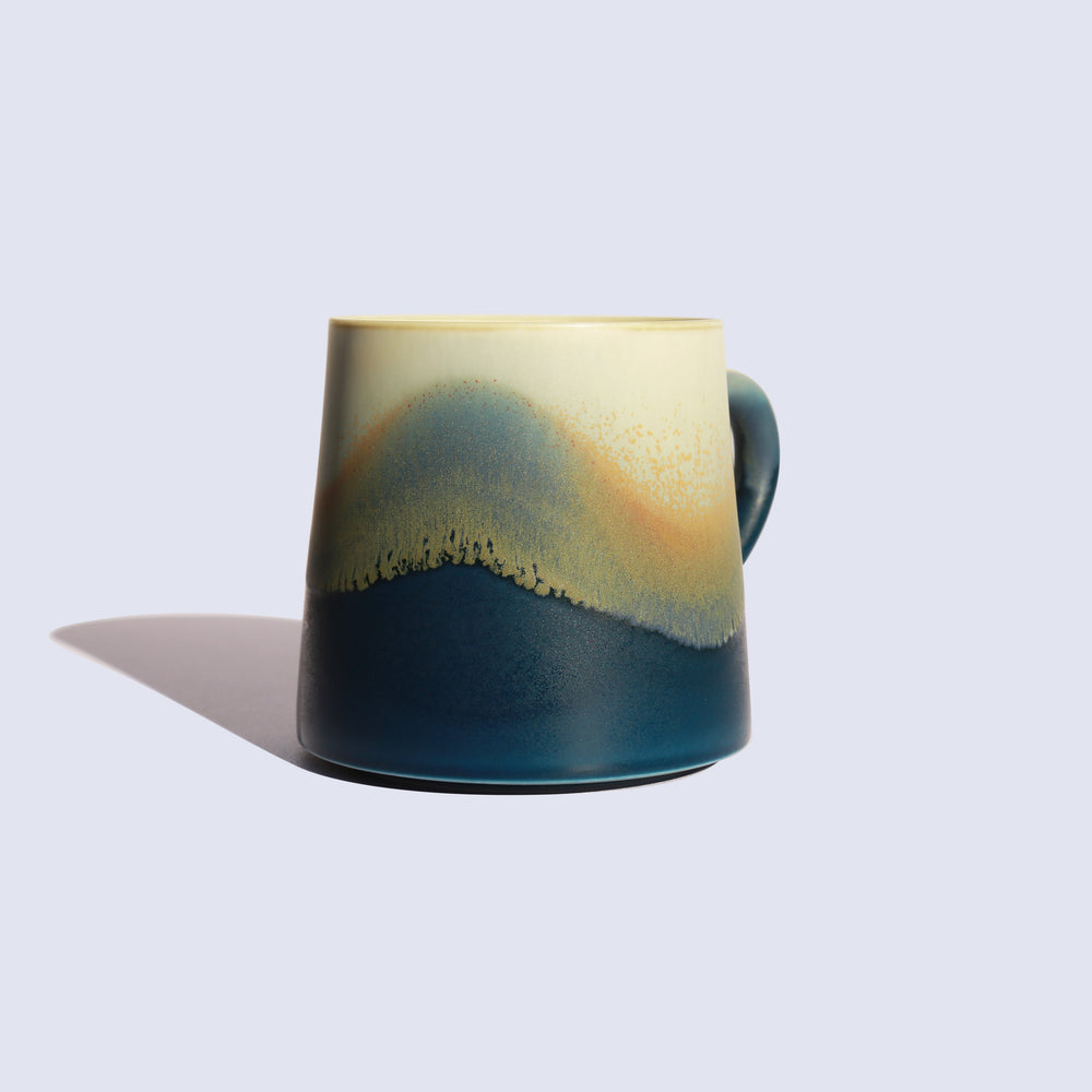 
                  
                    Blue ceramic coffee mug
                  
                