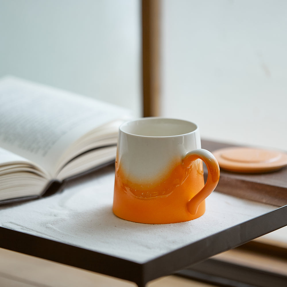 
                  
                    Orange ceramic mug
                  
                